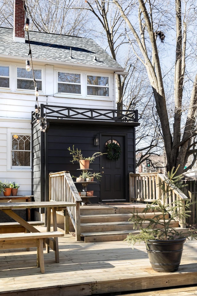 entrance to property with a deck