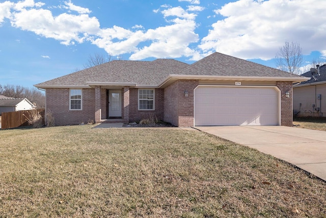 ranch-style home with a garage and a front lawn