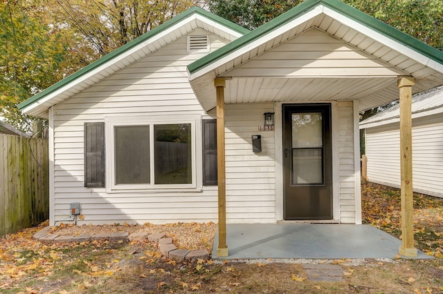 doorway to property with a patio area