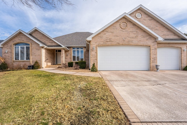 view of front facade featuring a garage and a front lawn