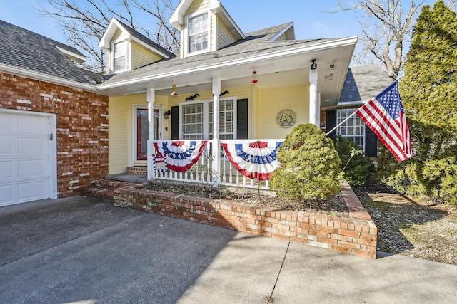 view of front of home with a garage and covered porch