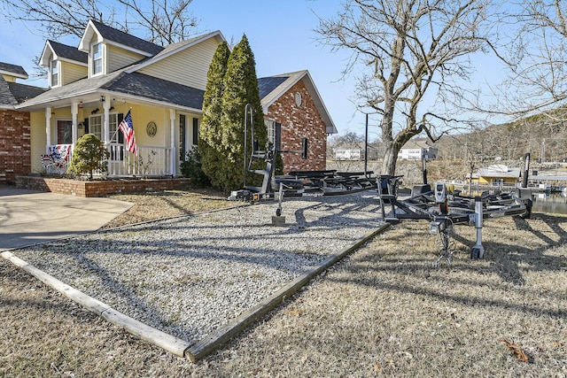 view of side of home featuring a porch