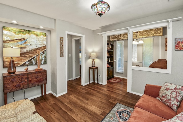 living room with dark hardwood / wood-style floors