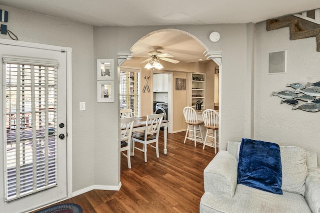 dining space with ceiling fan and dark hardwood / wood-style floors