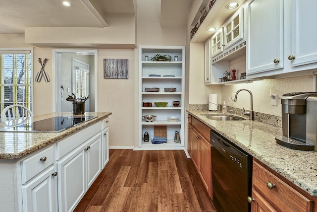 kitchen featuring sink, dark hardwood / wood-style floors, black appliances, light stone countertops, and white cabinets