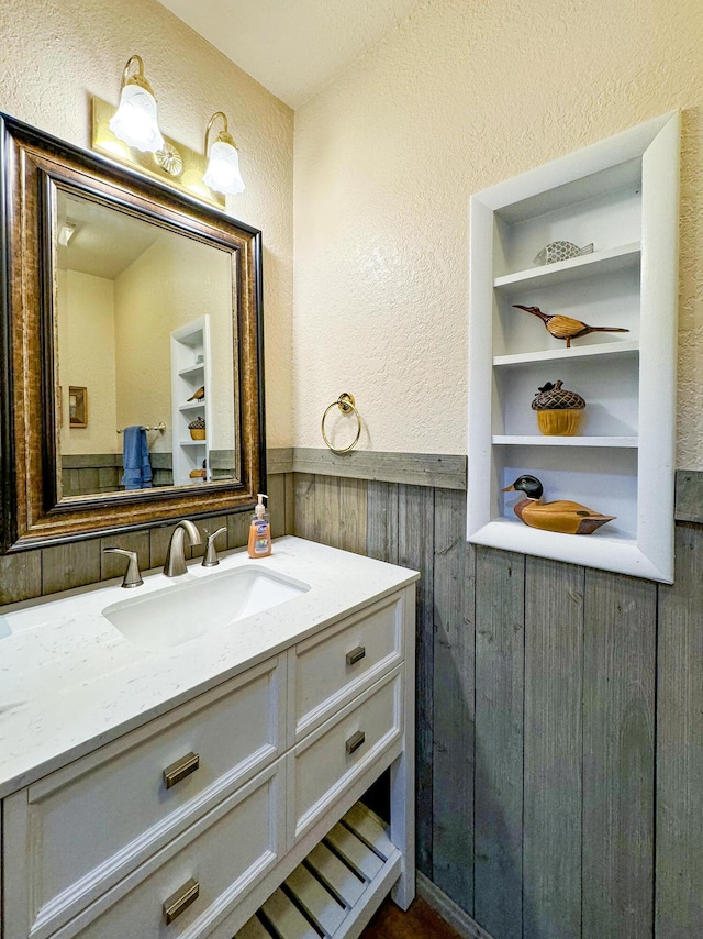 bathroom with vanity and built in features