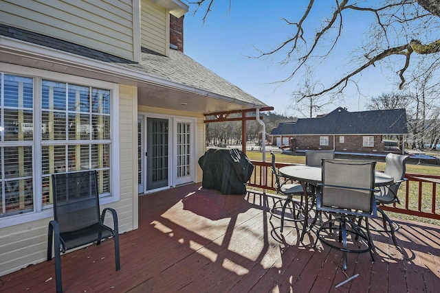 deck featuring a grill