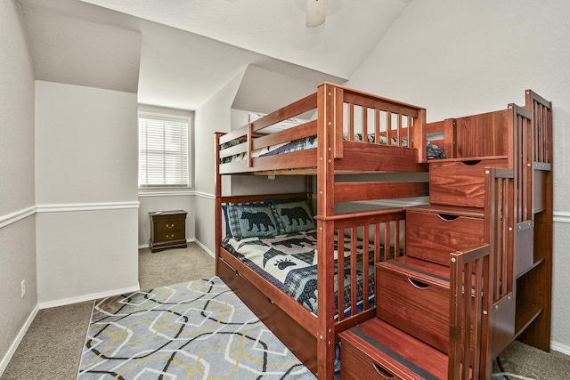 bedroom with vaulted ceiling, carpet, and ceiling fan