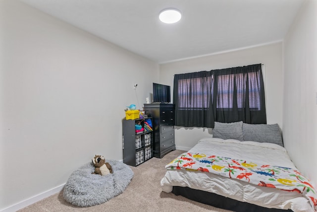 bedroom with light colored carpet