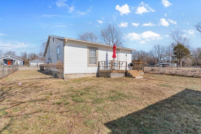 exterior space with a yard and a deck