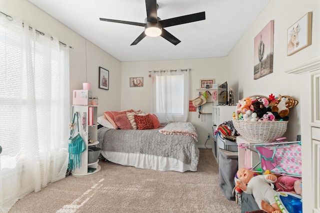 bedroom with ceiling fan and carpet flooring