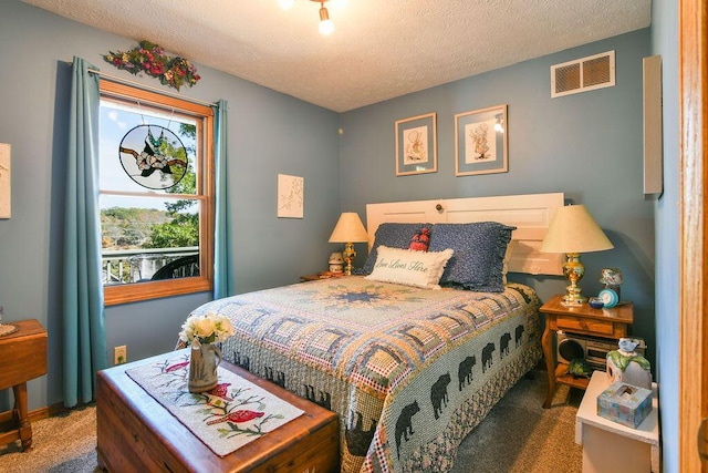 carpeted bedroom with a textured ceiling