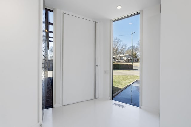 entryway featuring expansive windows