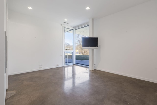 empty room featuring expansive windows