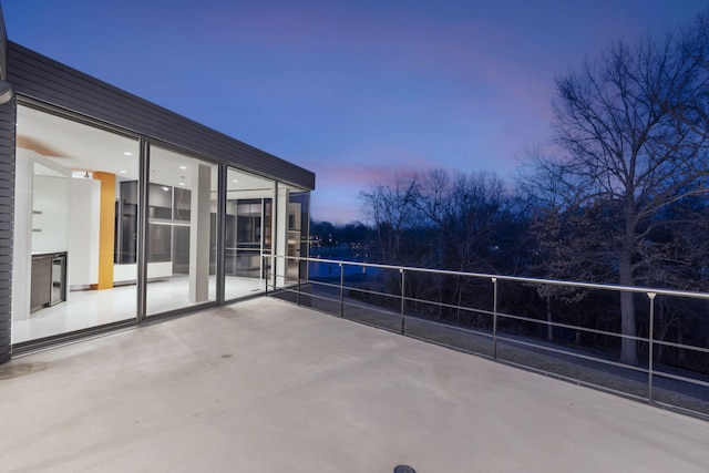 patio terrace at dusk with a balcony