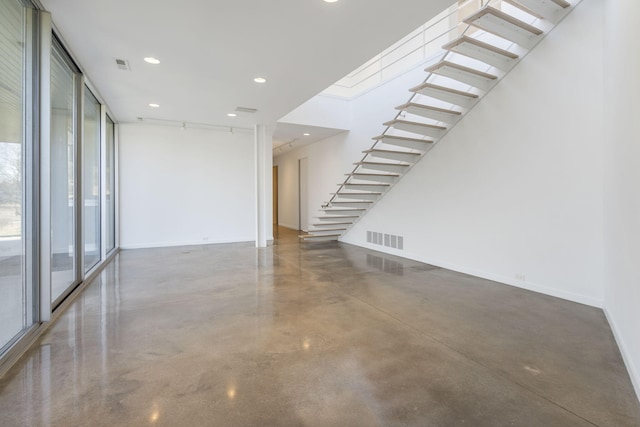 empty room featuring floor to ceiling windows