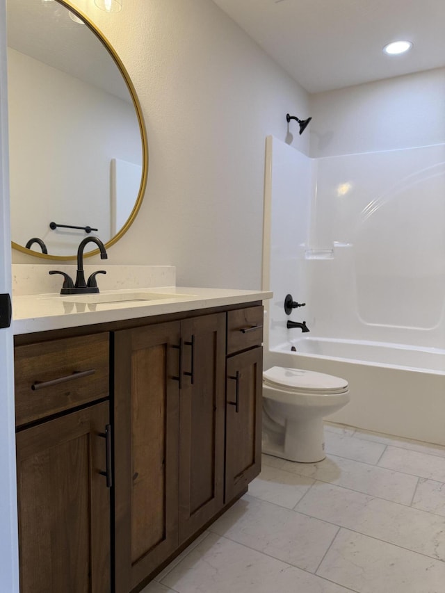 full bathroom with vanity, toilet, and washtub / shower combination