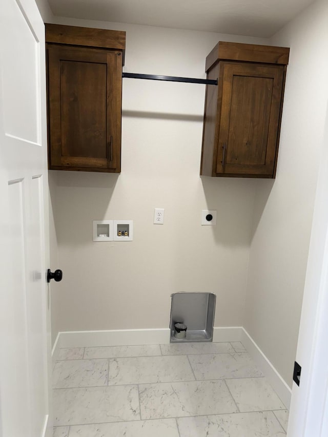 laundry room featuring cabinets, hookup for a washing machine, and hookup for an electric dryer