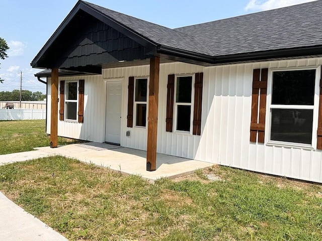 view of home's exterior with a lawn and a patio