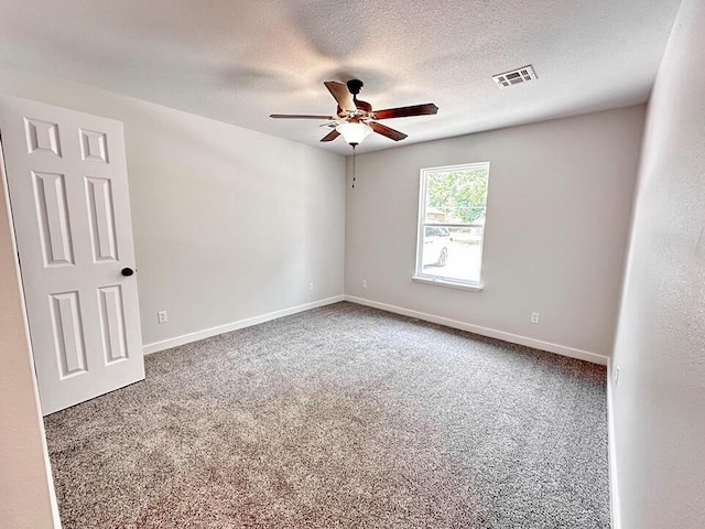 unfurnished room with carpet flooring, a textured ceiling, and ceiling fan