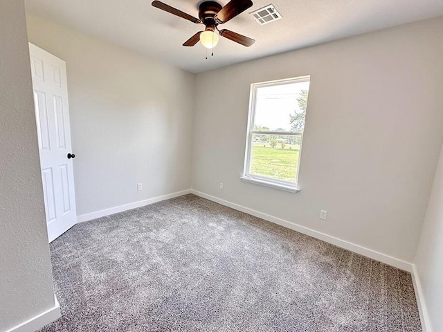 empty room featuring carpet floors and ceiling fan