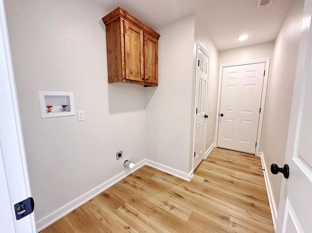 laundry room featuring cabinets, washer hookup, light hardwood / wood-style floors, and electric dryer hookup