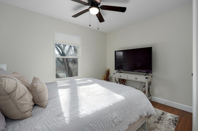 bedroom with wood-type flooring and ceiling fan