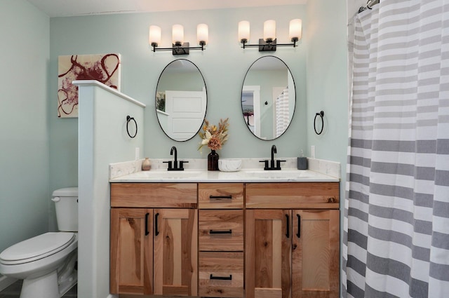 bathroom featuring vanity, a shower with shower curtain, and toilet