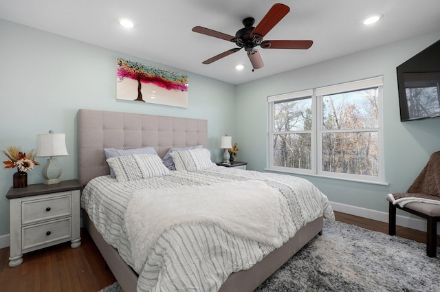 bedroom featuring dark wood-type flooring and ceiling fan