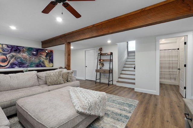 living room featuring beamed ceiling, ceiling fan, and hardwood / wood-style floors