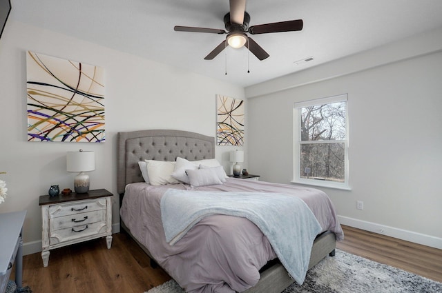 bedroom featuring dark hardwood / wood-style floors and ceiling fan