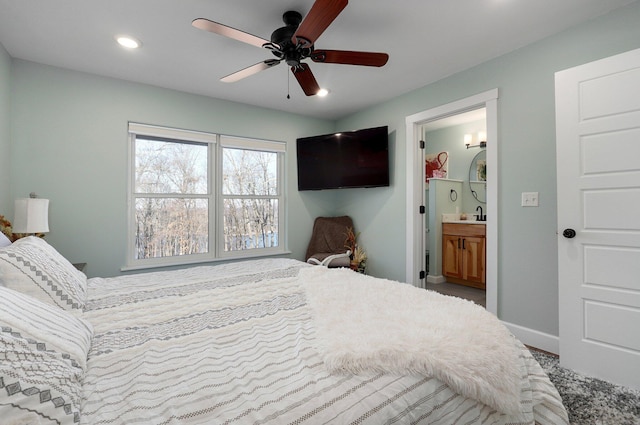 bedroom featuring ensuite bath and ceiling fan