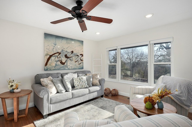 living room featuring ceiling fan and wood-type flooring