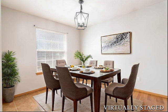 dining room with a notable chandelier