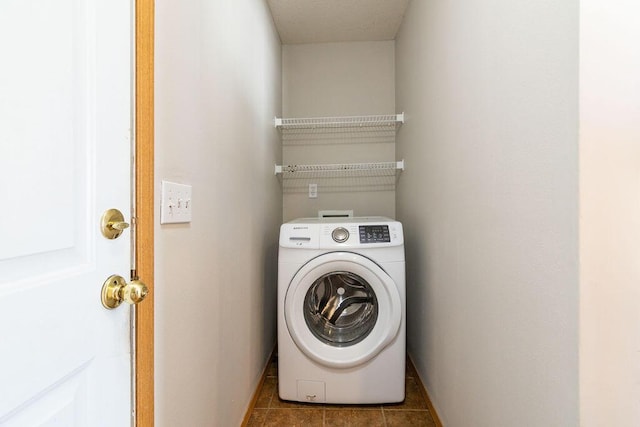 washroom featuring tile patterned floors and washer / dryer