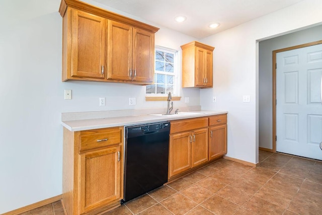 kitchen with dishwasher, sink, and light tile patterned floors