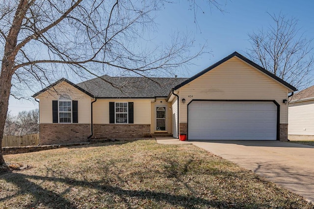 ranch-style home featuring a garage and a front yard