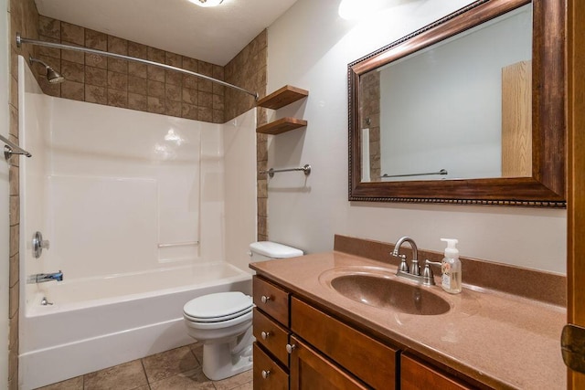 full bathroom featuring vanity, tile patterned floors, toilet, and washtub / shower combination