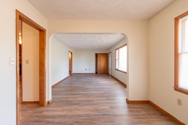 corridor featuring light hardwood / wood-style floors