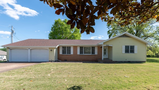 ranch-style house with a garage and a front yard