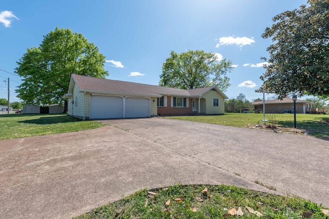 ranch-style home with a garage and a front yard