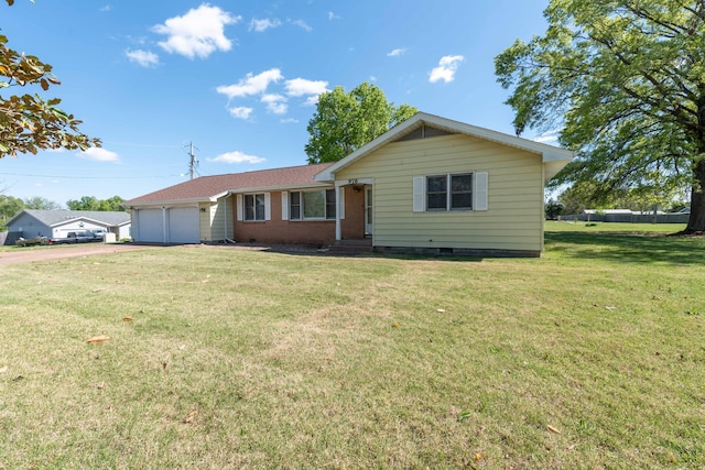 ranch-style house with a garage and a front yard