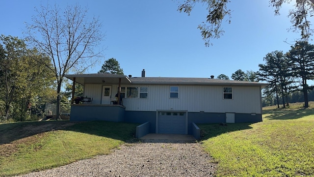 view of front of house featuring a garage and a front yard