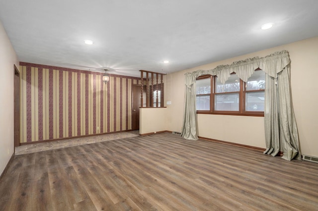 empty room with dark wood-type flooring