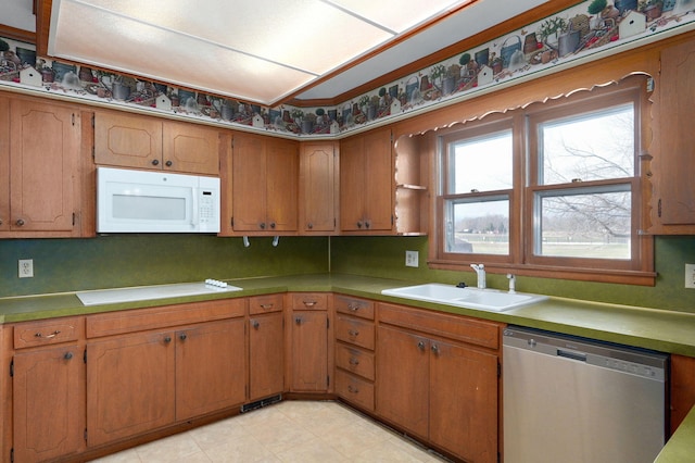 kitchen featuring stainless steel dishwasher and sink