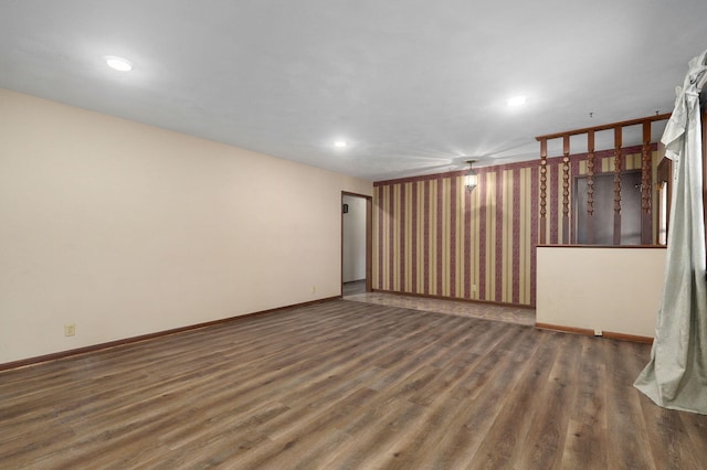 spare room featuring dark wood-type flooring