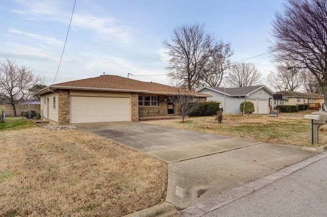 single story home with a garage and a front yard