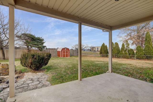 view of patio with a storage unit