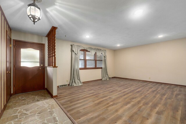 foyer entrance with hardwood / wood-style floors