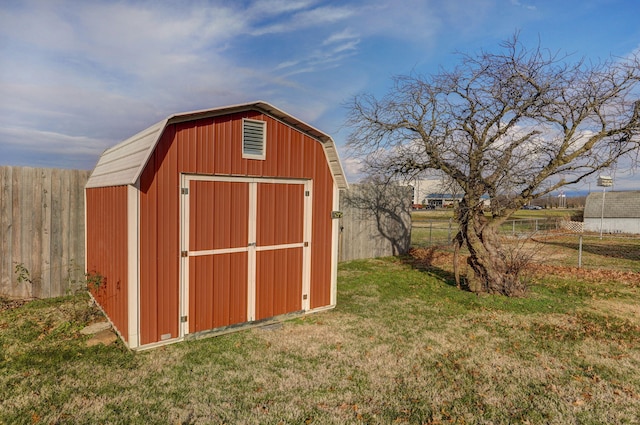 view of outdoor structure featuring a lawn